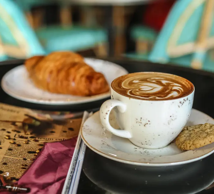 coffee-latter-with-cookies-croissant-side-view.jpg